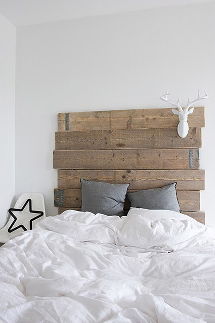 Reclaimed wood plank Headboard adds warmth to g...