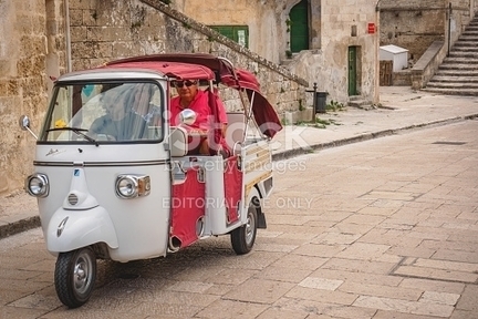 Tourists On A Piaggio Ape Calessino Used As A T