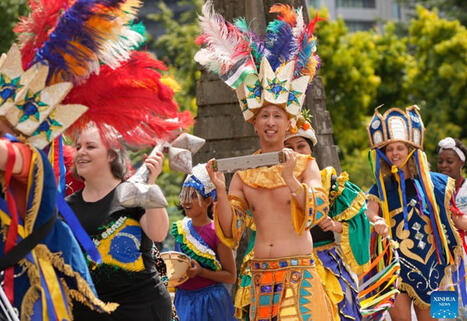 Participants in traditional costumes march during Parade of Cultures at Fusion Festival in Canada | Language and Culture | Scoop.it