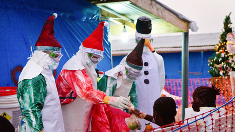 Santa hats and spray paint spruce up Ebola gear for Christmas | Ebola Outbreak 2014 | Scoop.it