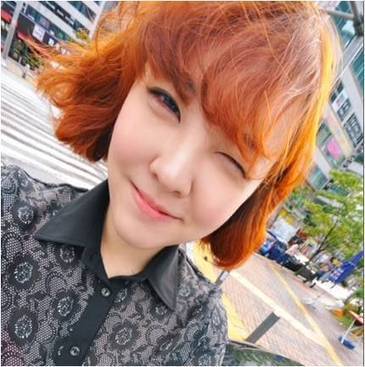 Orange Brown Hair Color With Fluffy Short Hairc